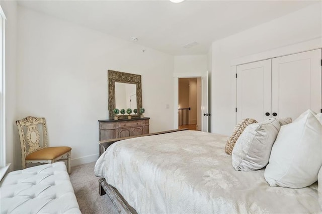 carpeted bedroom featuring a closet