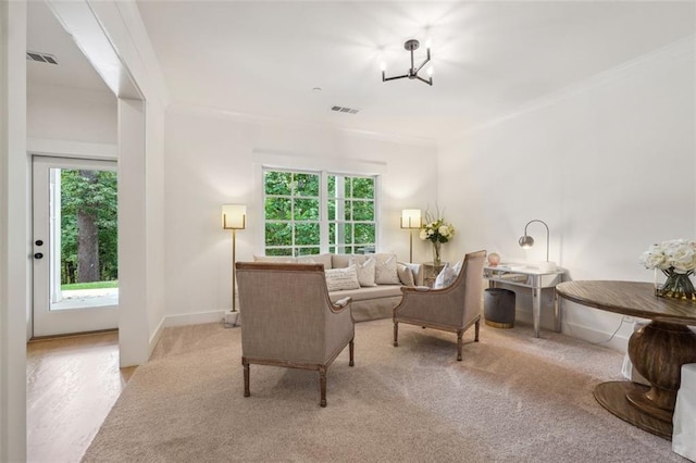 carpeted living room featuring crown molding