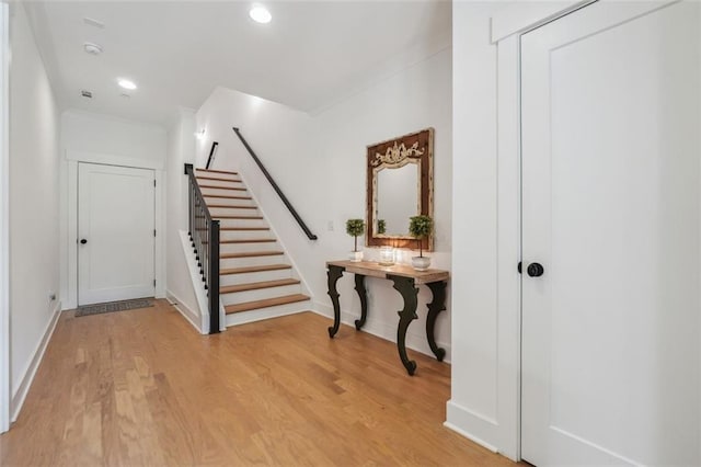 foyer with light hardwood / wood-style floors