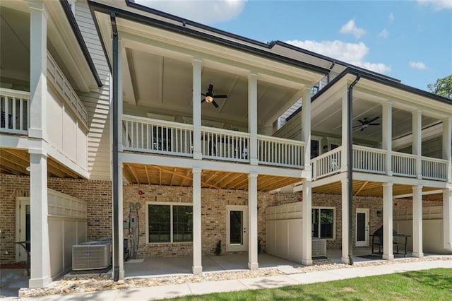 back of house with a patio, ceiling fan, and a balcony