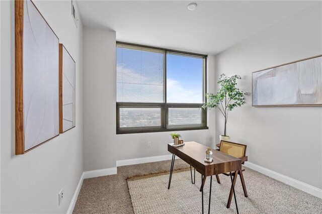 office space featuring carpet and baseboards