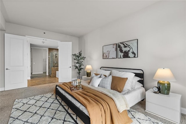 bedroom featuring carpet and baseboards