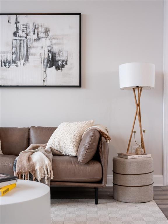 living area featuring baseboards