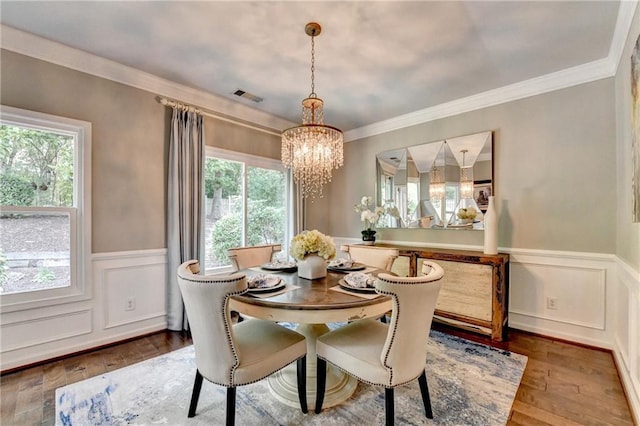 510 Elgaen Ct, Roswell, GA 30075 - dining space featuring a chandelier, healthy amount of natural light, wainscoting, wood finished floors, and ornamental molding