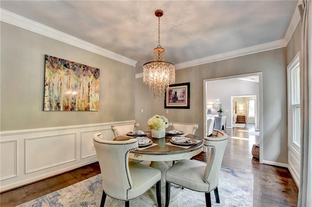 510 Elgaen Ct, Roswell, GA 30075 - dining space with a chandelier, dark wood-style flooring, ornamental molding, and a wainscoted wall