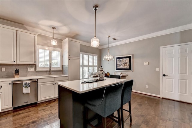 510 Elgaen Ct, Roswell, GA 30075 - kitchen with stainless steel dishwasher, light countertops, white cabinetry, and ornamental molding