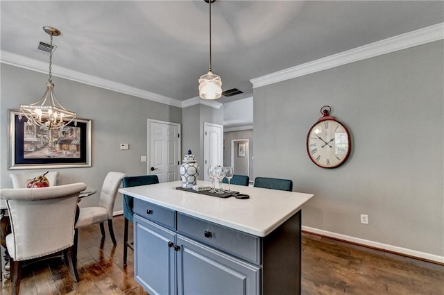 510 Elgaen Ct, Roswell, GA 30075 - kitchen featuring a chandelier, ornamental molding, dark wood-type flooring, a kitchen island, and hanging light fixtures