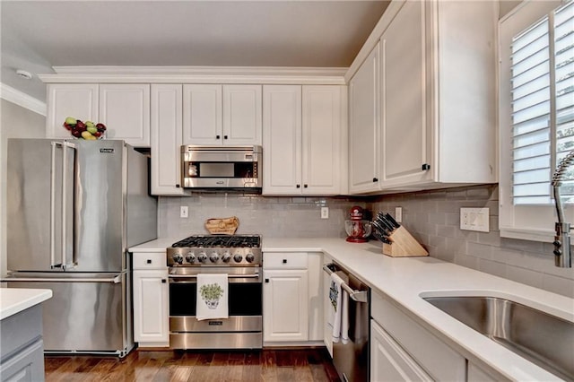 510 Elgaen Ct, Roswell, GA 30075 - kitchen with high end appliances, light countertops, healthy amount of natural light, and crown molding
