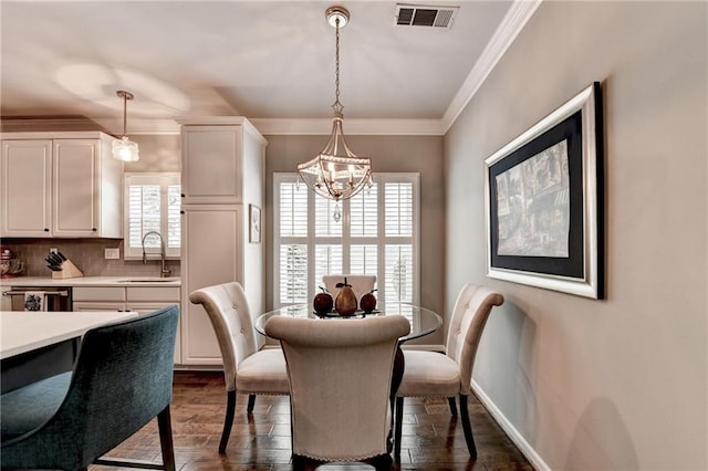 510 Elgaen Ct, Roswell, GA 30075 - dining room with dark wood-type flooring, a chandelier, and ornamental molding