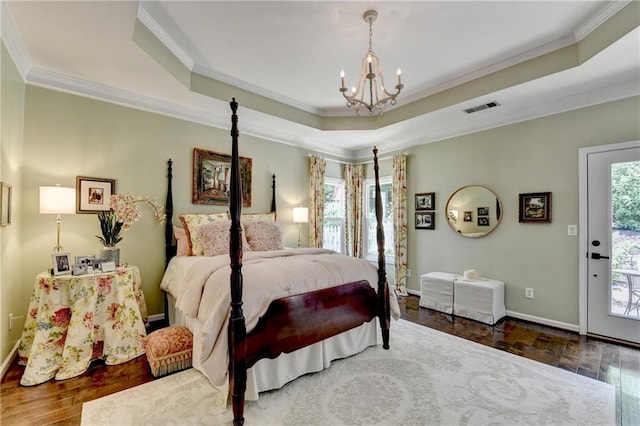 510 Elgaen Ct, Roswell, GA 30075 - bedroom featuring a chandelier, crown molding, a tray ceiling, wood finished floors, and access to outside
