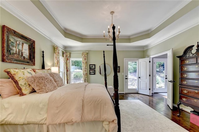 510 Elgaen Ct, Roswell, GA 30075 - bedroom with a chandelier, dark wood-type flooring, crown molding, access to outside, and a tray ceiling