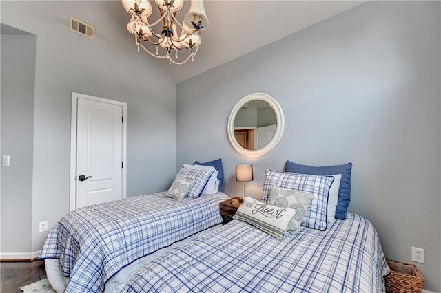 510 Elgaen Ct, Roswell, GA 30075 - bedroom with a chandelier, wood finished floors, and high vaulted ceiling