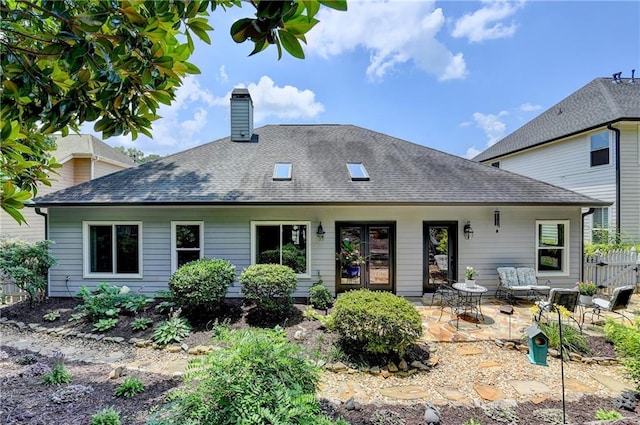 510 Elgaen Ct, Roswell, GA 30075 - back of house featuring a chimney, roof with shingles, a patio area, and french doors