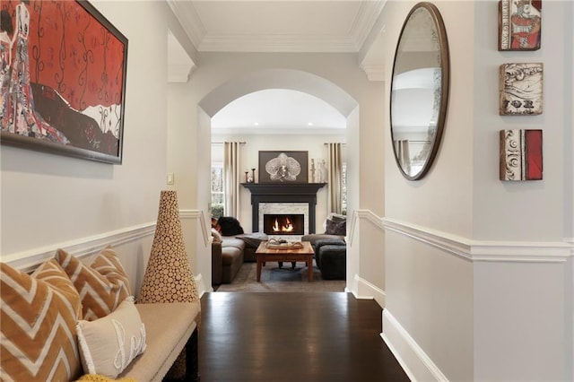 hall featuring dark wood-type flooring and ornamental molding