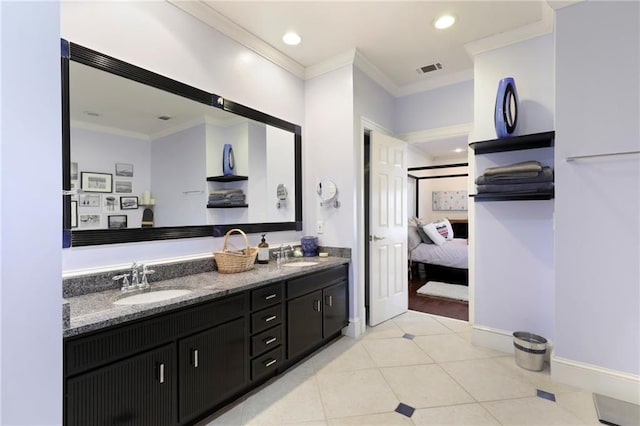 bathroom featuring crown molding, dual sinks, vanity with extensive cabinet space, and hardwood / wood-style flooring