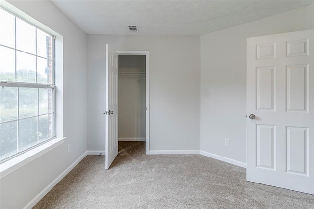 6118 Arbor Links Rd, Lithonia, GA 30058 - unfurnished bedroom with carpet floors, a closet, and a spacious closet