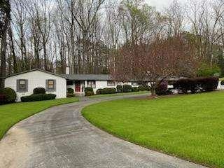 view of property's community with a lawn