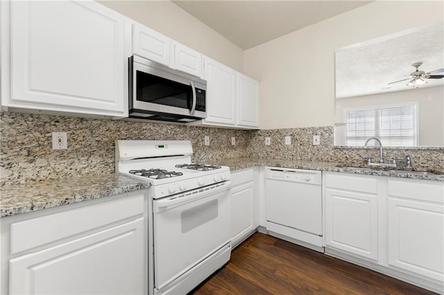 4100 Howell Park Rd, Duluth, GA 30096 - kitchen featuring white appliances, a sink, dark wood-type flooring, ceiling fan, and light stone counters