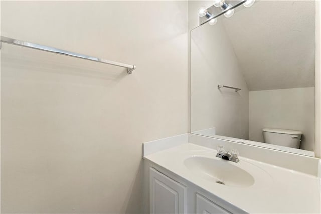 4100 Howell Park Rd, Duluth, GA 30096 - half bath with lofted ceiling, vanity, and toilet