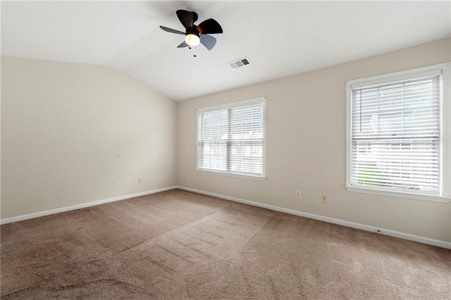 4100 Howell Park Rd, Duluth, GA 30096 - empty room featuring lofted ceiling, a ceiling fan, baseboards, carpet flooring, and plenty of natural light