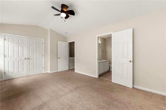 4100 Howell Park Rd, Duluth, GA 30096 - unfurnished bedroom with vaulted ceiling, light colored carpet, baseboards, a closet, and ensuite bathroom