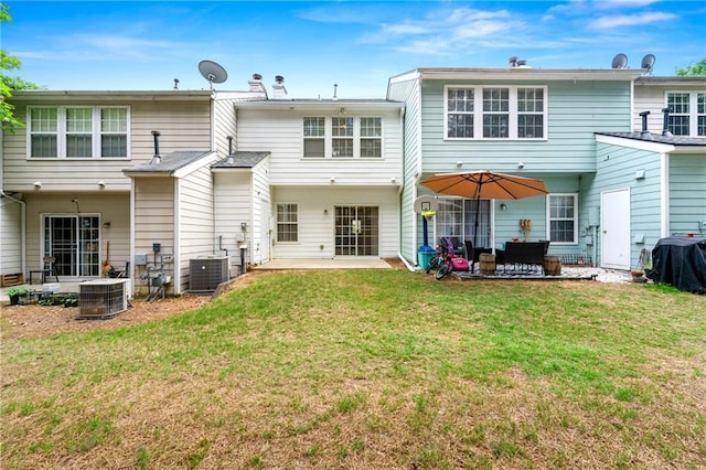 4100 Howell Park Rd, Duluth, GA 30096 - back of property featuring a patio, a yard, central AC, and a chimney