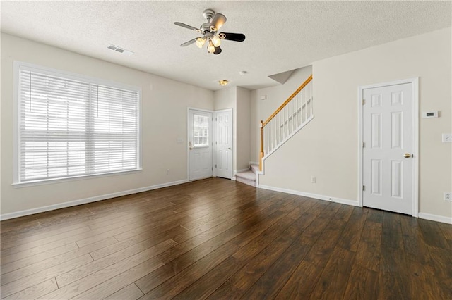 4100 Howell Park Rd, Duluth, GA 30096 - unfurnished living room with a ceiling fan, a textured ceiling, stairs, dark wood-style floors, and baseboards
