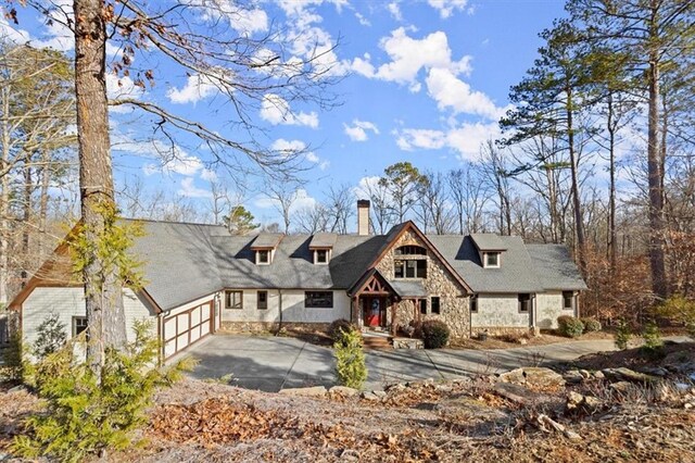 tudor-style house featuring a garage