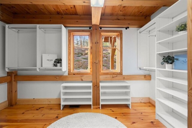 bedroom featuring wood ceiling, access to exterior, light wood-type flooring, ceiling fan, and beam ceiling