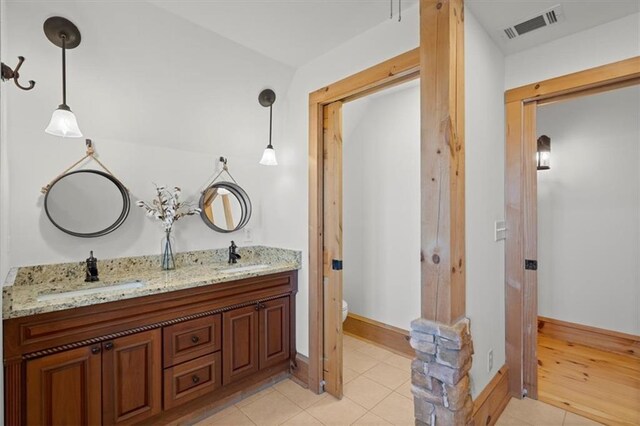 bathroom featuring ceiling fan, tile patterned floors, vanity, and plus walk in shower