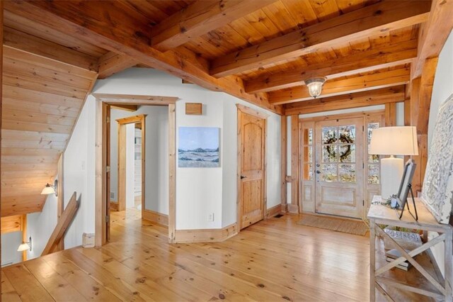 hallway with wooden ceiling, beamed ceiling, and light wood-type flooring