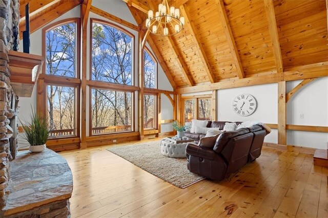 doorway with beamed ceiling, light hardwood / wood-style floors, and wooden ceiling