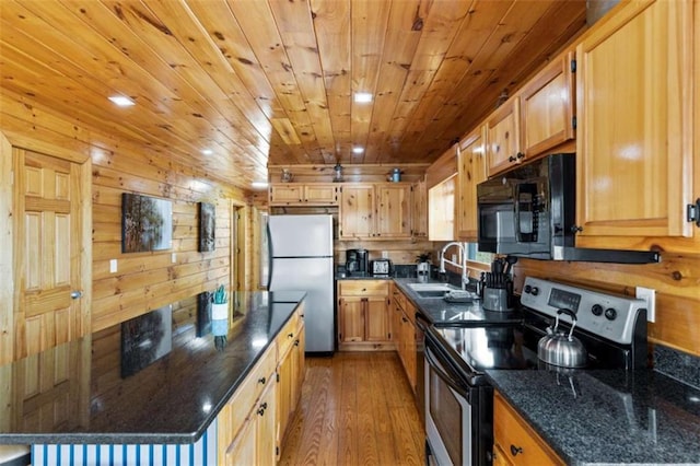 kitchen with stainless steel appliances, wood-type flooring, wooden ceiling, a center island, and a sink