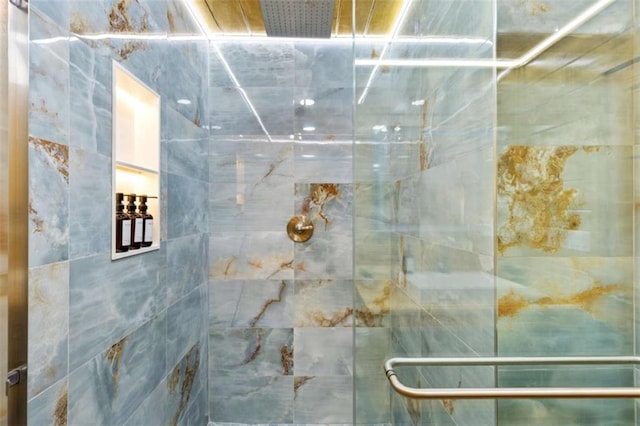 bathroom with a tile shower