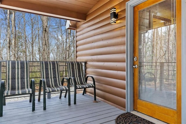 entrance to property with log veneer siding