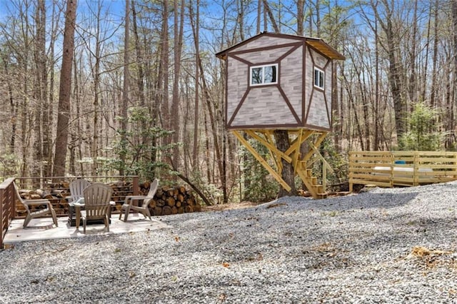 view of outbuilding with fence