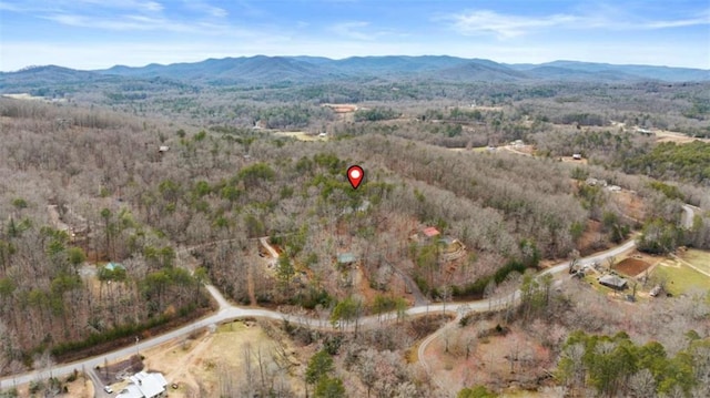 aerial view of property and surrounding area featuring mountains