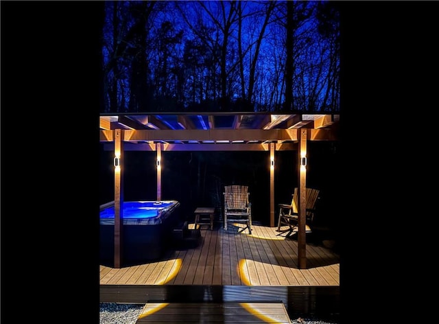 wooden terrace with a hot tub and a pergola