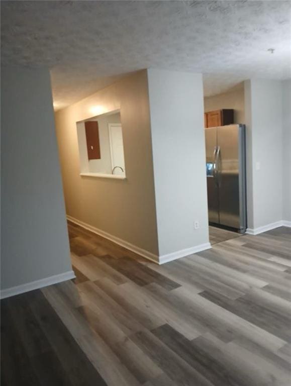 spare room with dark wood-type flooring