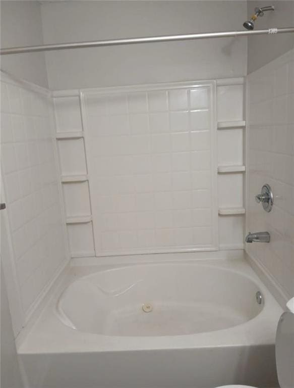 bathroom with toilet and shower / bathtub combination