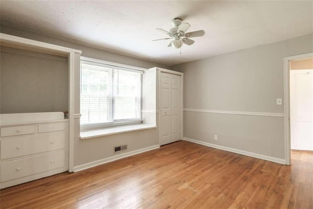 unfurnished bedroom with light hardwood / wood-style flooring and ceiling fan