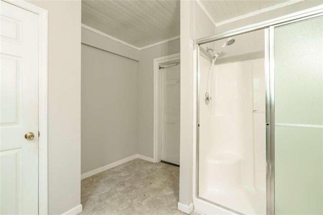 bathroom with walk in shower and ornamental molding