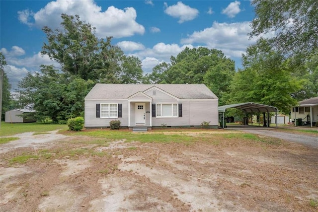 view of front of home featuring a carport