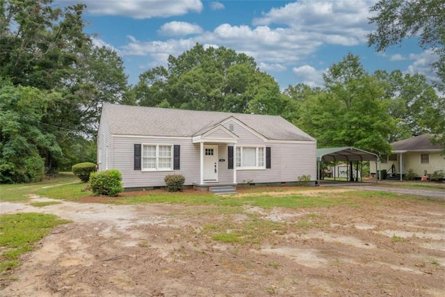 view of front of house featuring a carport