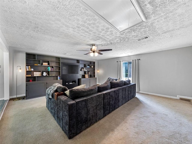 30 Court S, Ellenwood, GA 30294 - living room with attic access, light carpet, a textured ceiling, and a ceiling fan