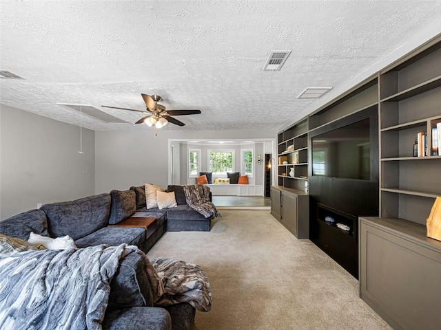 30 Court S, Ellenwood, GA 30294 - living area with light colored carpet, ceiling fan, and a textured ceiling