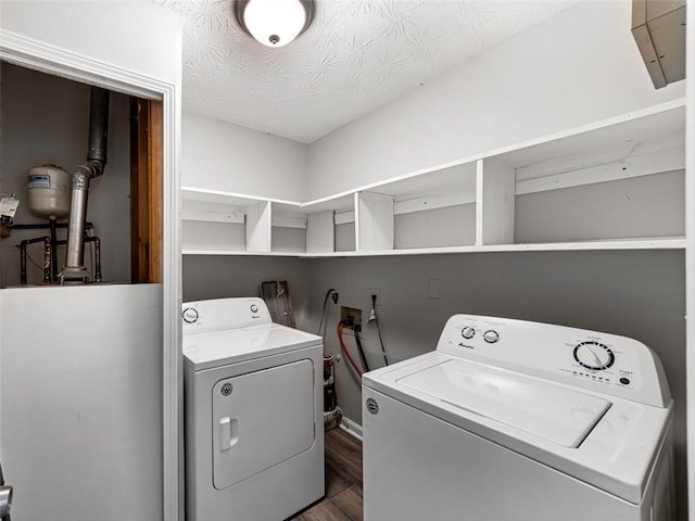 30 Court S, Ellenwood, GA 30294 - laundry area with washing machine and clothes dryer, dark wood-style flooring, water heater, and a textured ceiling