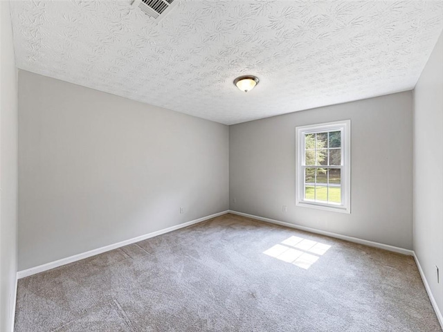 30 Court S, Ellenwood, GA 30294 - carpeted empty room with baseboards and a textured ceiling