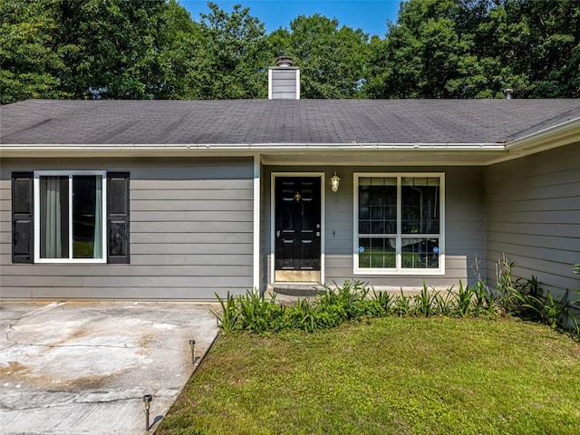 30 Court S, Ellenwood, GA 30294 - doorway to property with a lawn, covered porch, a chimney, and roof with shingles