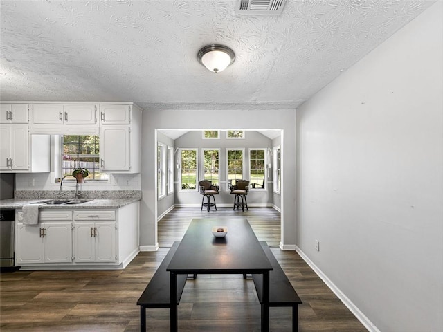 30 Court S, Ellenwood, GA 30294 - dining space featuring a textured ceiling and dark wood-style floors